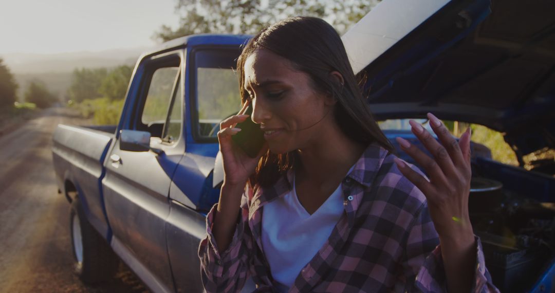 Distressed Woman Making Phone Call Next to Broken Down Truck on Rural Road - Free Images, Stock Photos and Pictures on Pikwizard.com