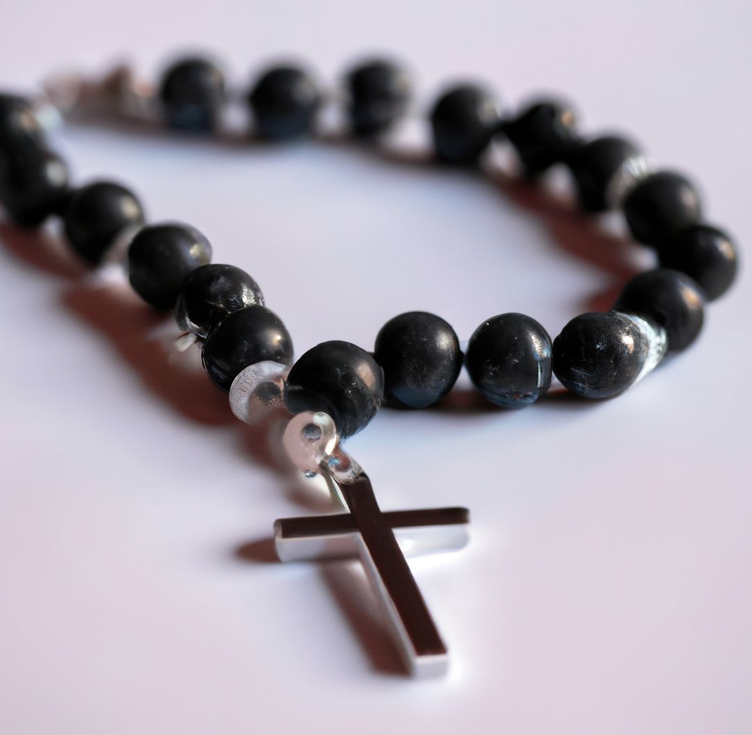 Close up of black rosary with cross on white background - Free Images, Stock Photos and Pictures on Pikwizard.com