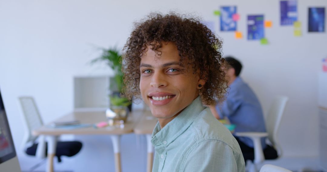 Cheerful Professional in Modern Office Environment