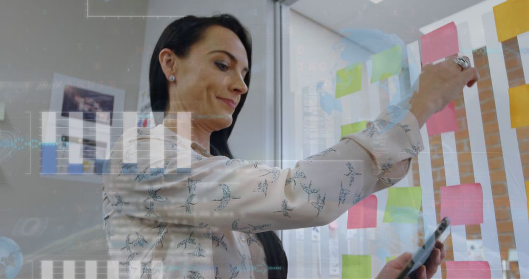 Businesswoman Organizing Sticky Notes with Digital Tablet