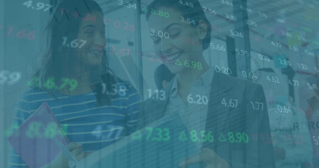 Female Coworkers Analyzing Financial Data in Office