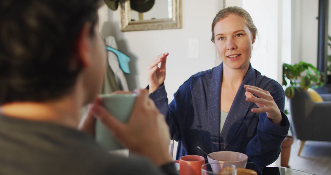 Woman Engaging in Conversation Over Coffee at Home - Free Images, Stock Photos and Pictures on Pikwizard.com