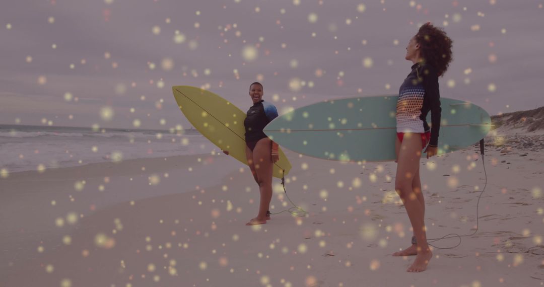 Joyful Surfers with Boards on Beach During Cloudy Sunset
