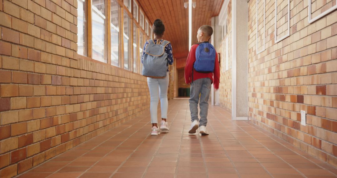 Kids Walking to Class in School Hallway
