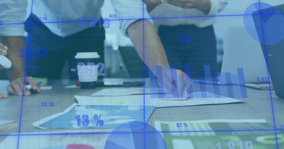 Business Team Analyzing Data Charts and Graphs