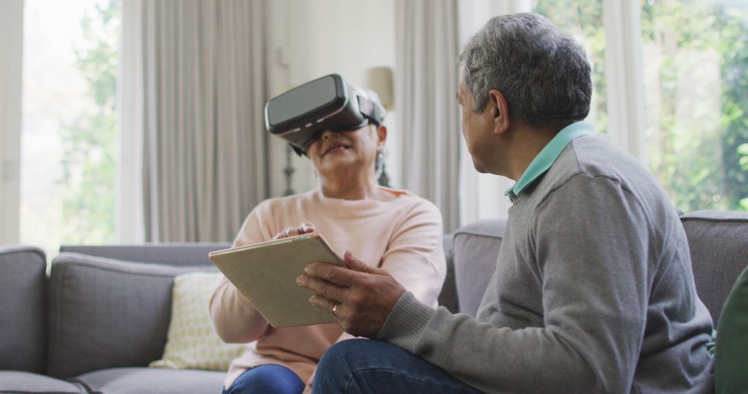 Senior Couple Enjoying Virtual Reality Experience in Living Room - Free Images, Stock Photos and Pictures on Pikwizard.com