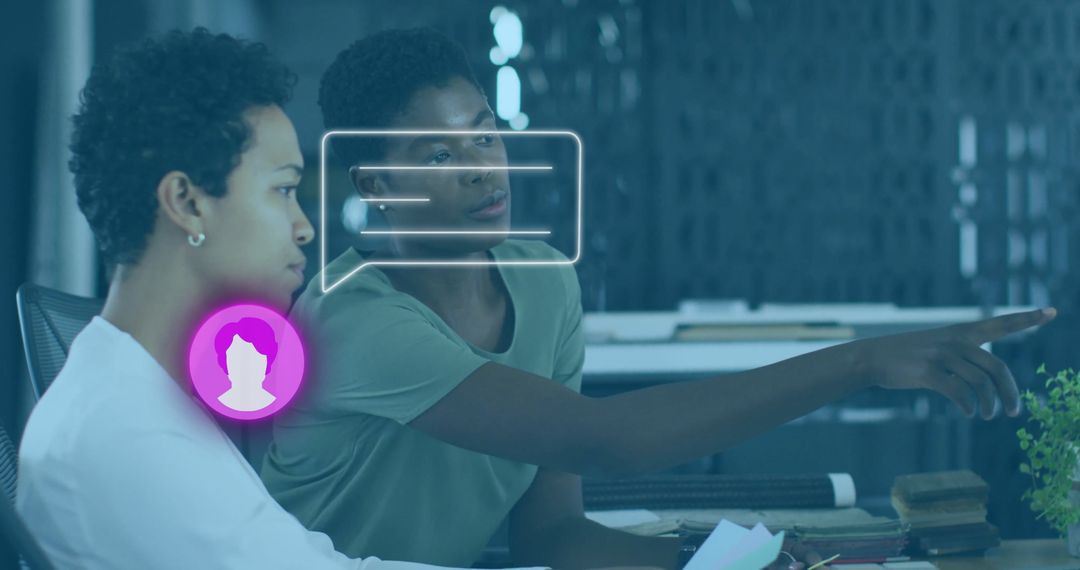 Colleagues Collaborating at Office Desk with Digital Icons