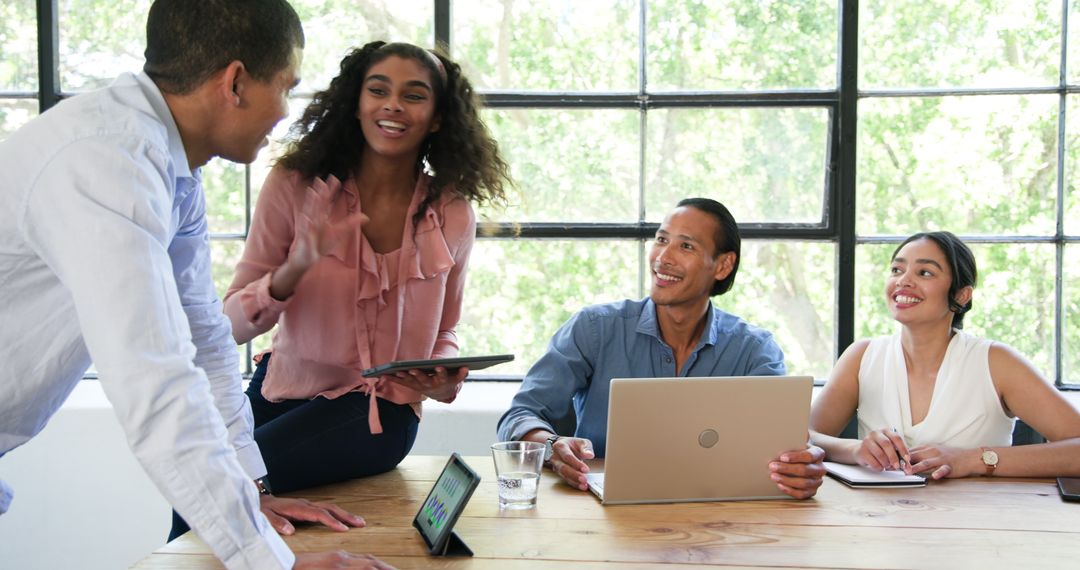 Diverse Team Collaborating Enthusiastically at Office Meeting