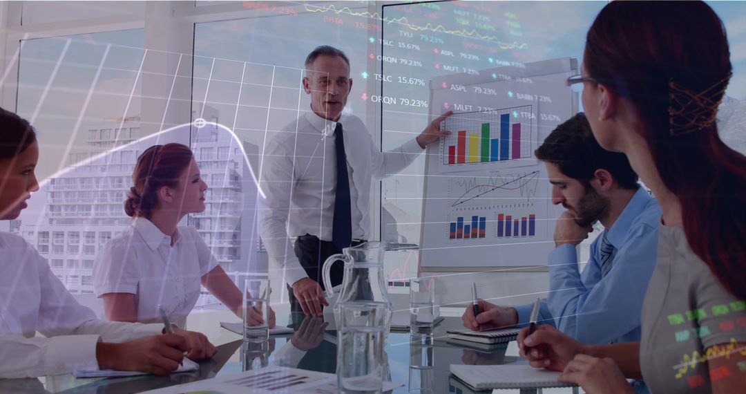 Diverse Team Analyzing Analytics and Charts in Boardroom Meeting