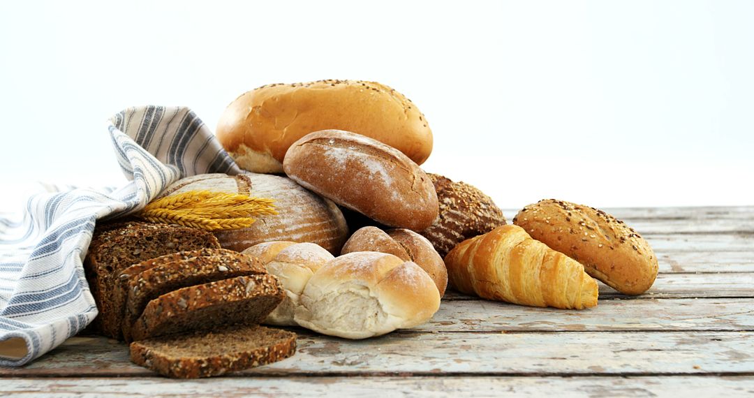 Assorted Fresh Bread Selection on Rustic Wooden Table - Free Images, Stock Photos and Pictures on Pikwizard.com