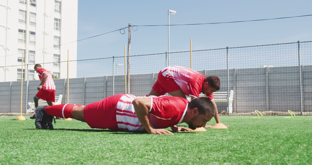 Soccer Players Training with Push-Ups on Field - Free Images, Stock Photos and Pictures on Pikwizard.com