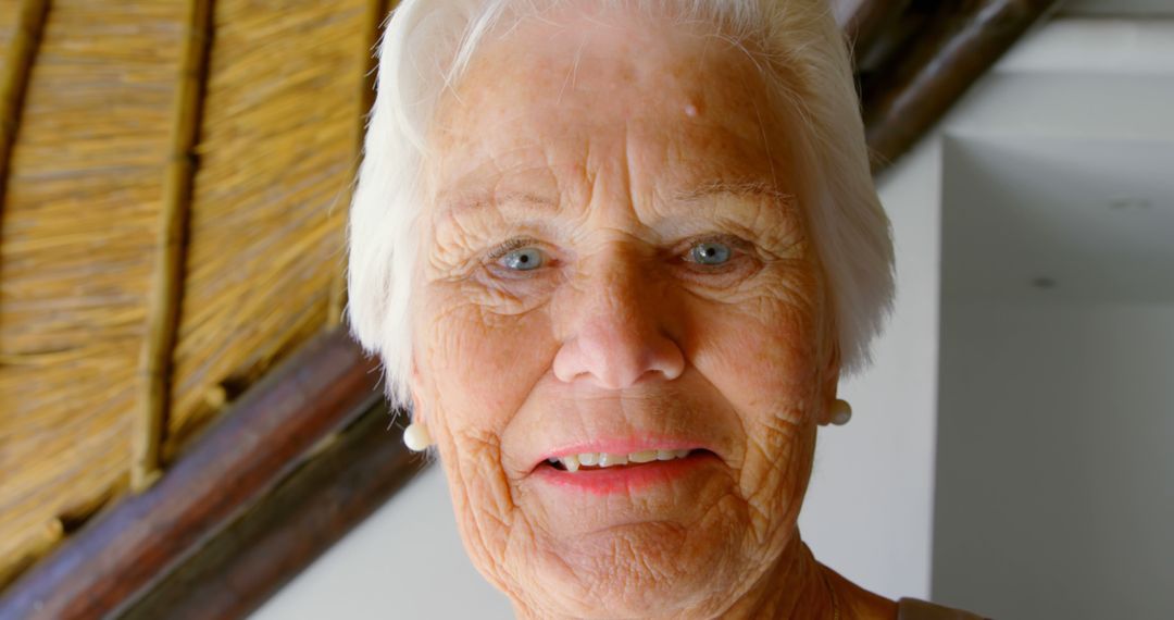 Elderly Woman Smiling in Cozy Home Environment - Free Images, Stock Photos and Pictures on Pikwizard.com