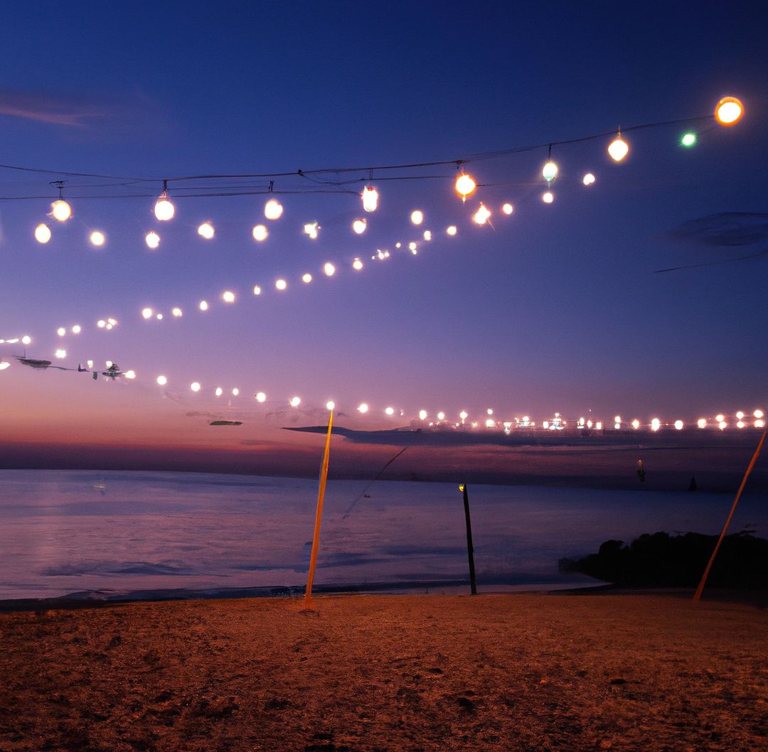 Image of close up of outdoor lights on string on beach at night - Free Images, Stock Photos and Pictures on Pikwizard.com