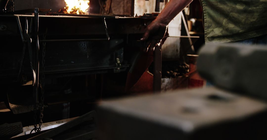 Blacksmith Working Metal in Foundry - Free Images, Stock Photos and Pictures on Pikwizard.com