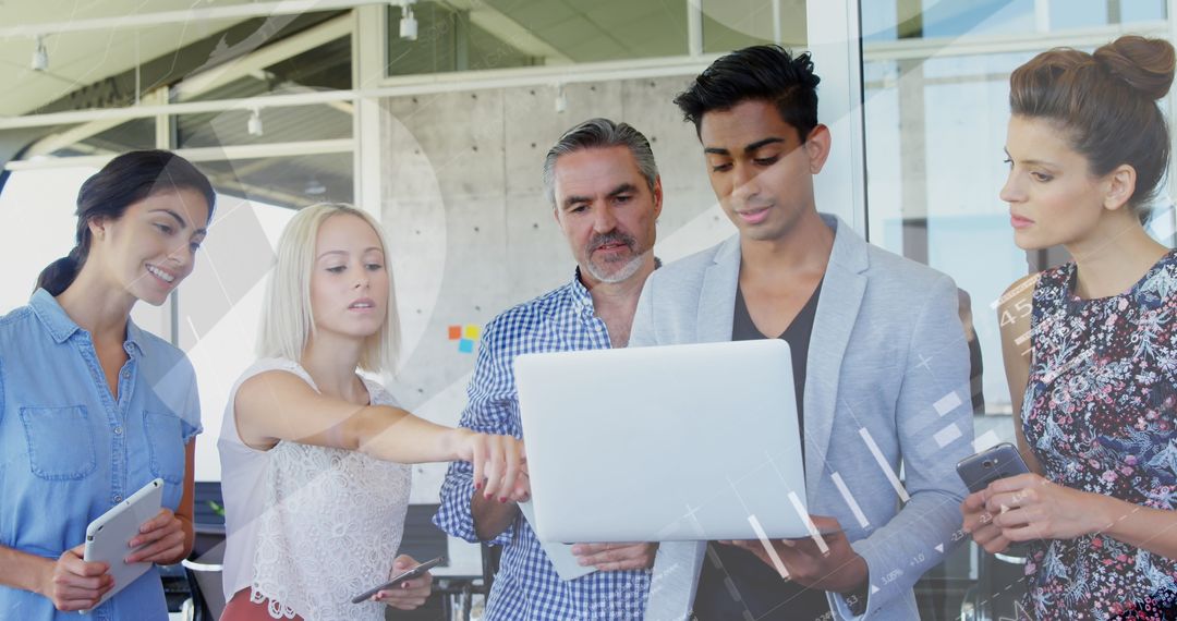 Diverse Team Collaborating on Data Analysis Project at Office