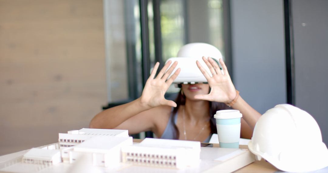 Woman Using VR Headset for Architecture Model Exploration