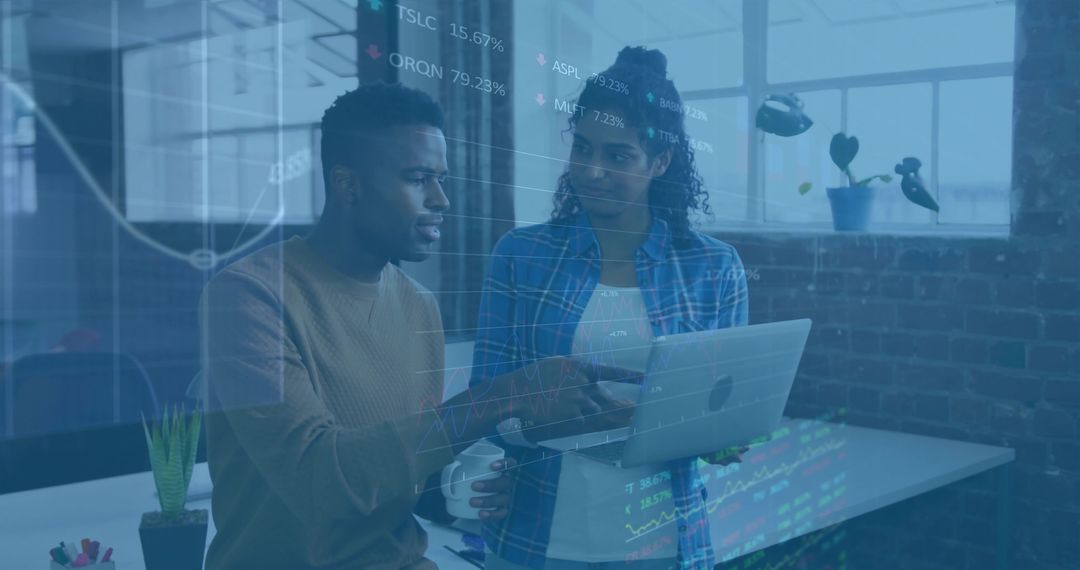 Colleagues Collaborating with Digital Data Overlay in Modern Tech Office