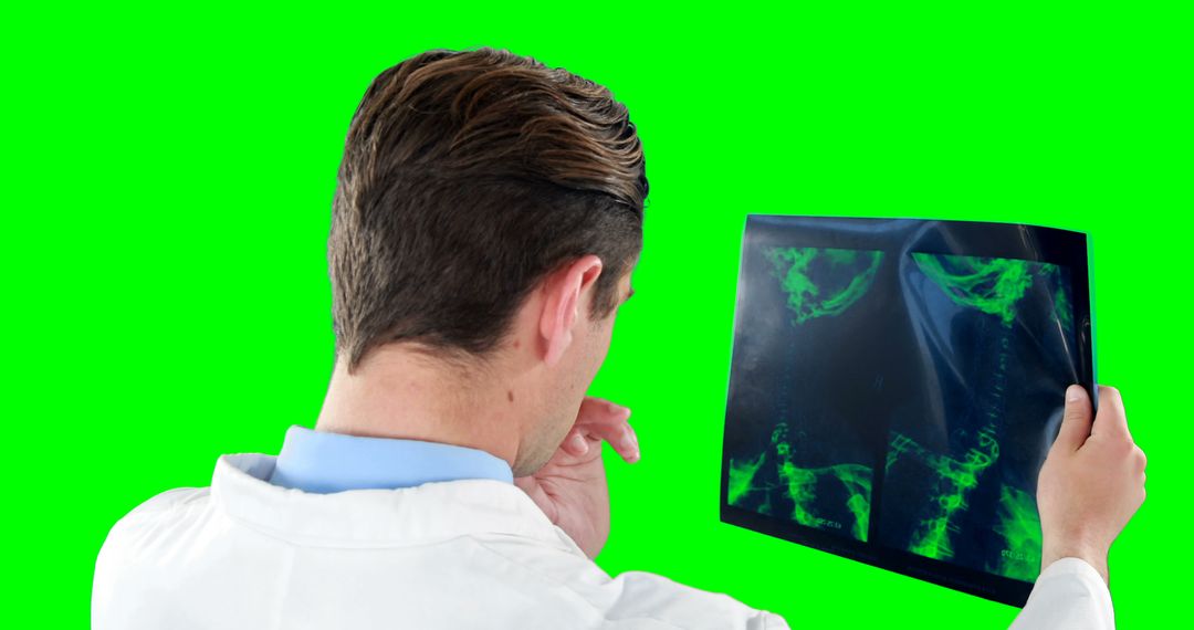 Doctor Analyzing X-Ray Film on Green Screen Background - Free Images, Stock Photos and Pictures on Pikwizard.com