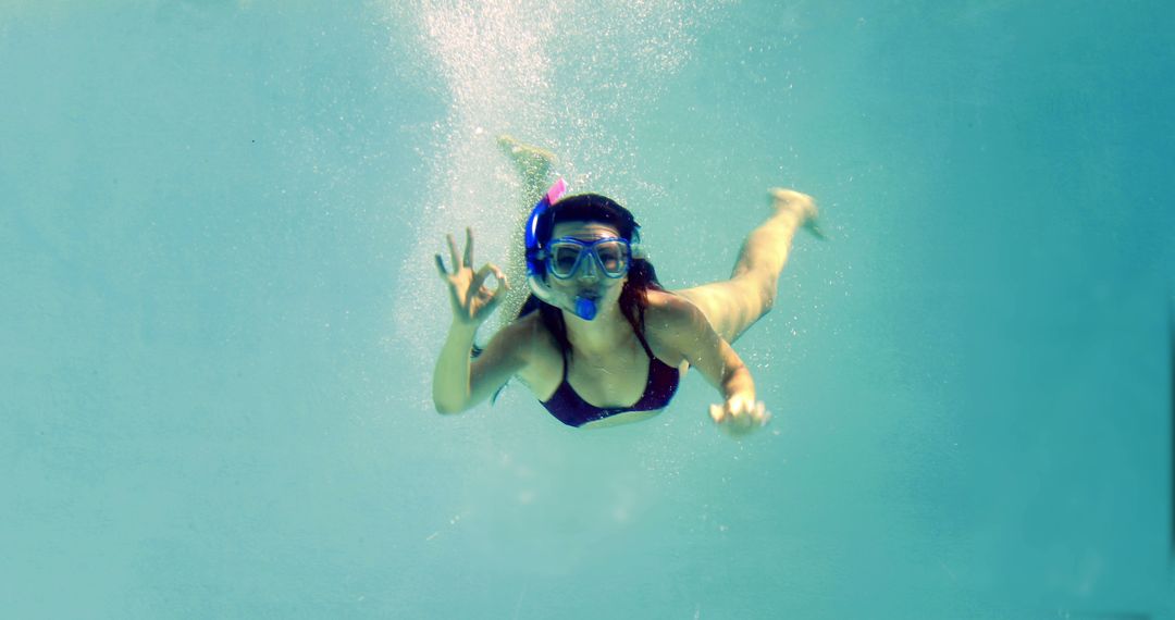 Woman Snorkeling Underwater Making OK Sign - Free Images, Stock Photos and Pictures on Pikwizard.com