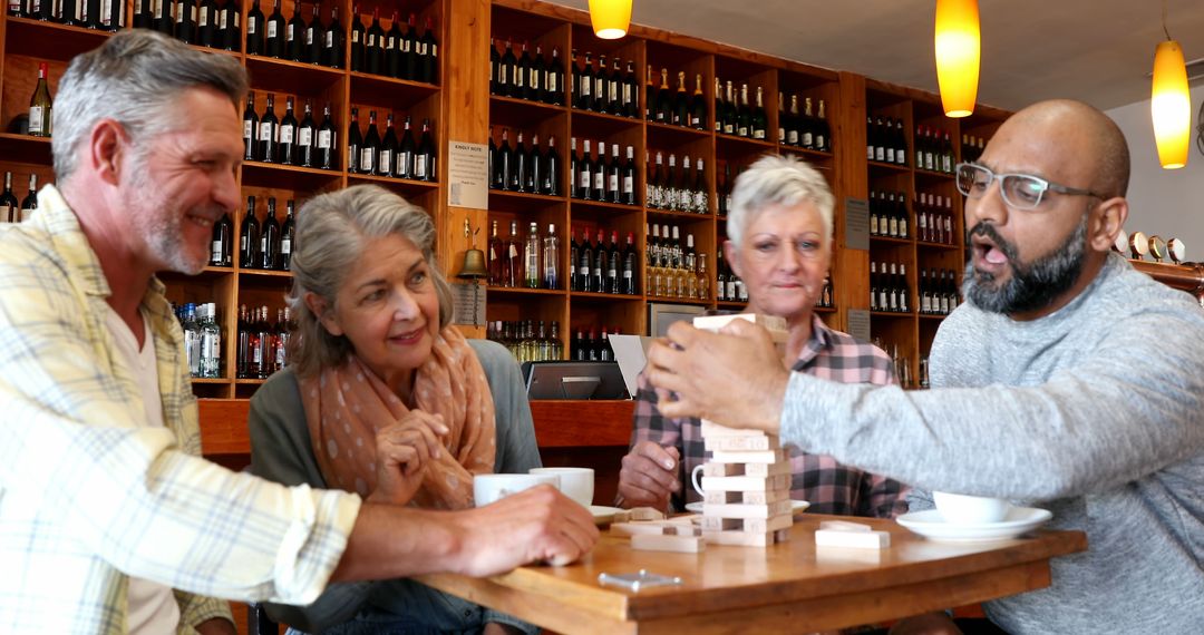 Friends Enjoying Jenga Game in Relaxed Cafe Atmosphere