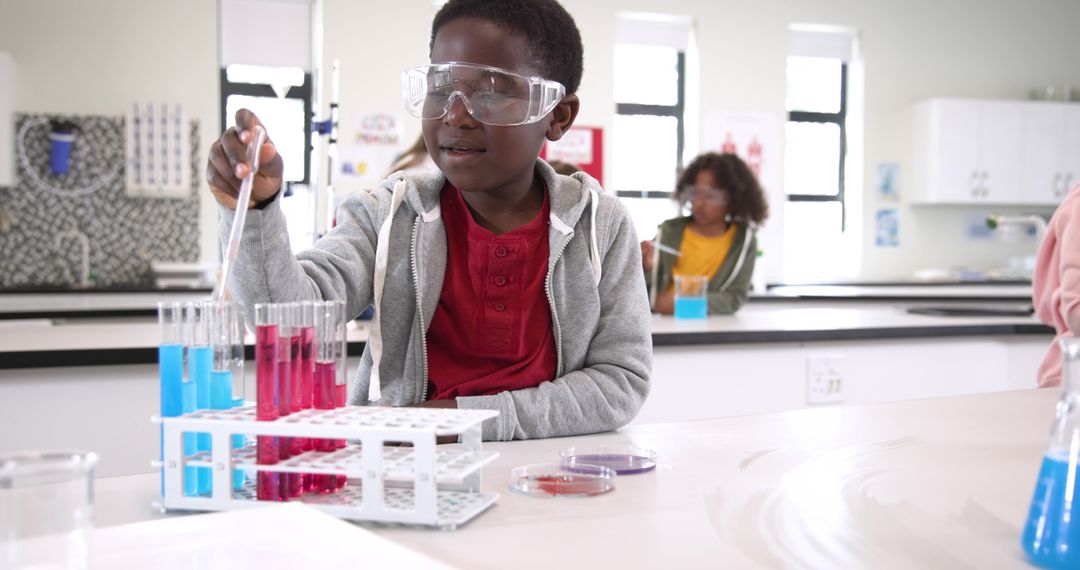 Students Conducting Experiments with Pipettes in School Science Lab