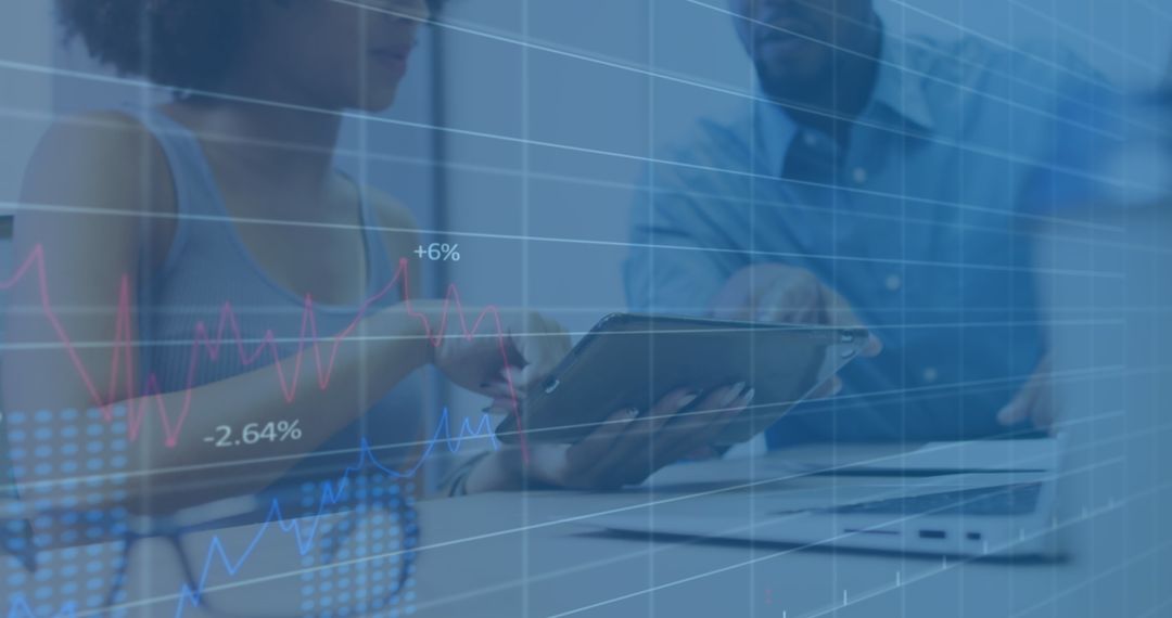 Business Professionals Analyzing Data with Digital Technology Interface