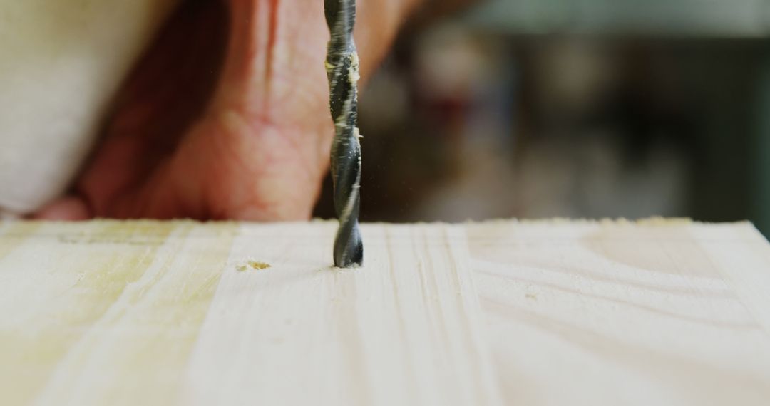 Close-Up of Hand Drilling Into Wood for Carpentry - Free Images, Stock Photos and Pictures on Pikwizard.com