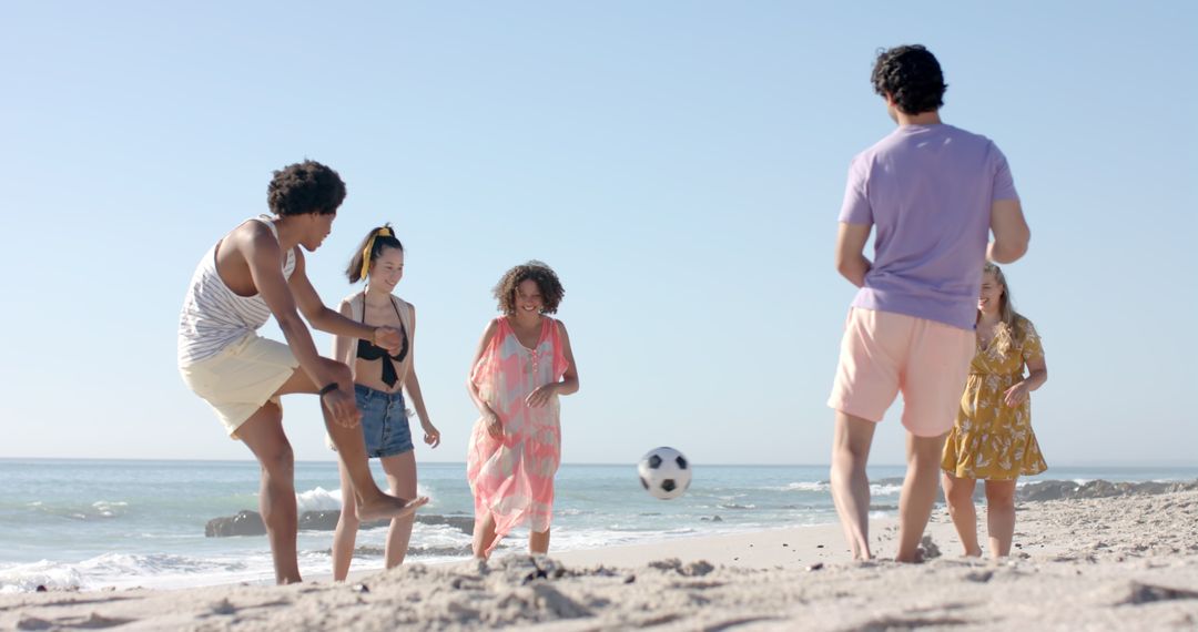 Beach Soccer Fun with Energetic Group of Friends Enjoying the Sunshine