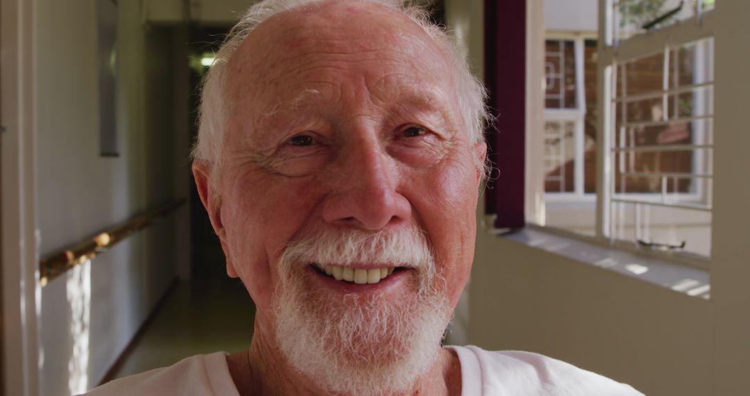 Smiling Senior Caucasian Man Enjoying Sunlight and Retirement