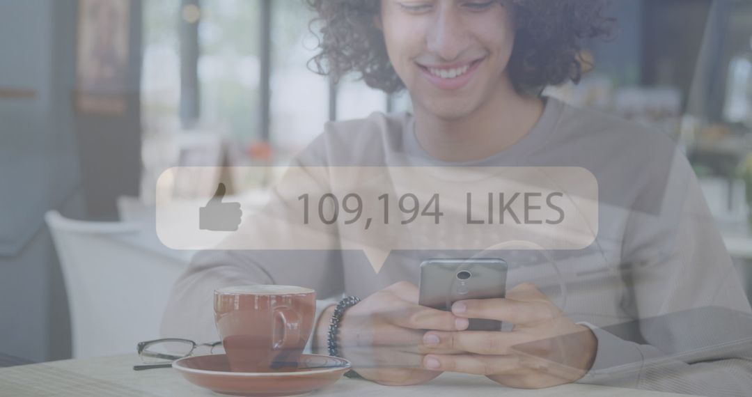 Young Man Engaging with Smartphone and Social Media in Café