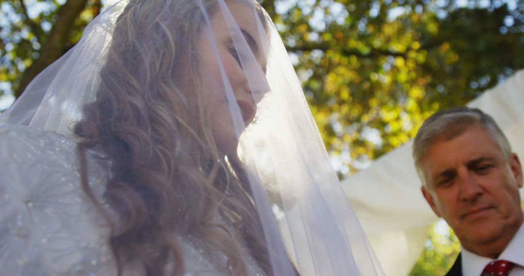 Bride Reflects on Wedding Day Accompanied by Family Member - Free Images, Stock Photos and Pictures on Pikwizard.com