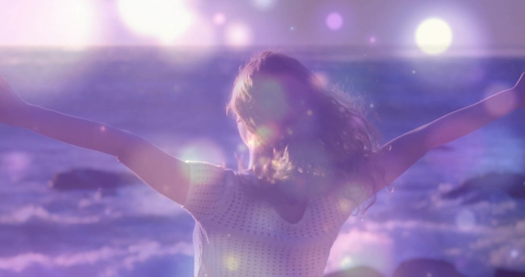 Woman Embracing Freedom at Serene Oceanfront