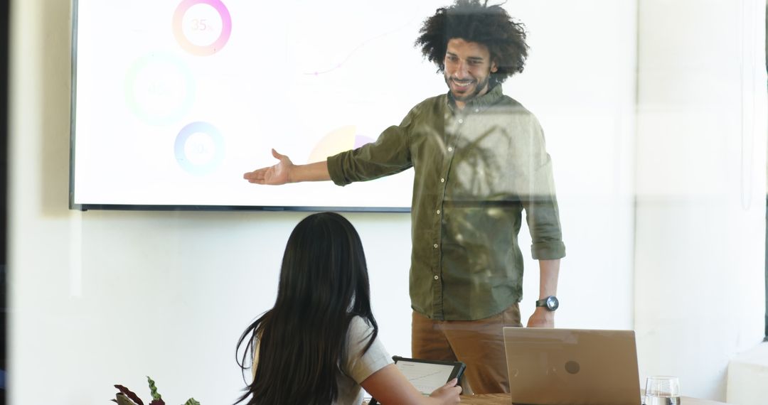 Business Professionals in Meeting Discussing Digital Presentation