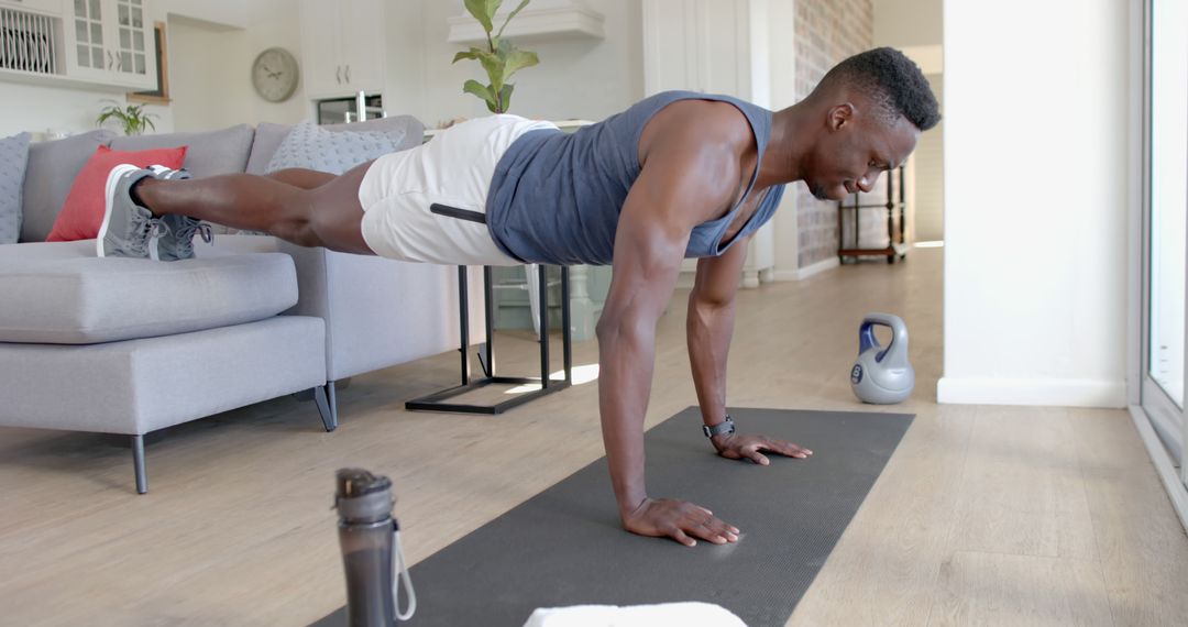 Man Performing Plank Exercise in Living Room for Home Workout - Free Images, Stock Photos and Pictures on Pikwizard.com