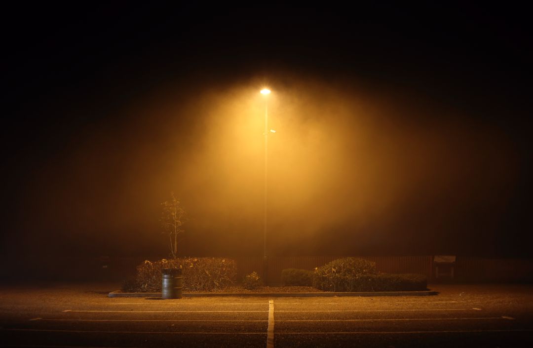 Foggy Night in Empty Parking Lot with Streetlight - Free Images, Stock Photos and Pictures on Pikwizard.com