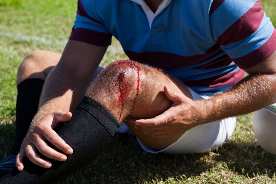 Mid section of rugby player with injured knee - Free Images, Stock Photos and Pictures on Pikwizard.com