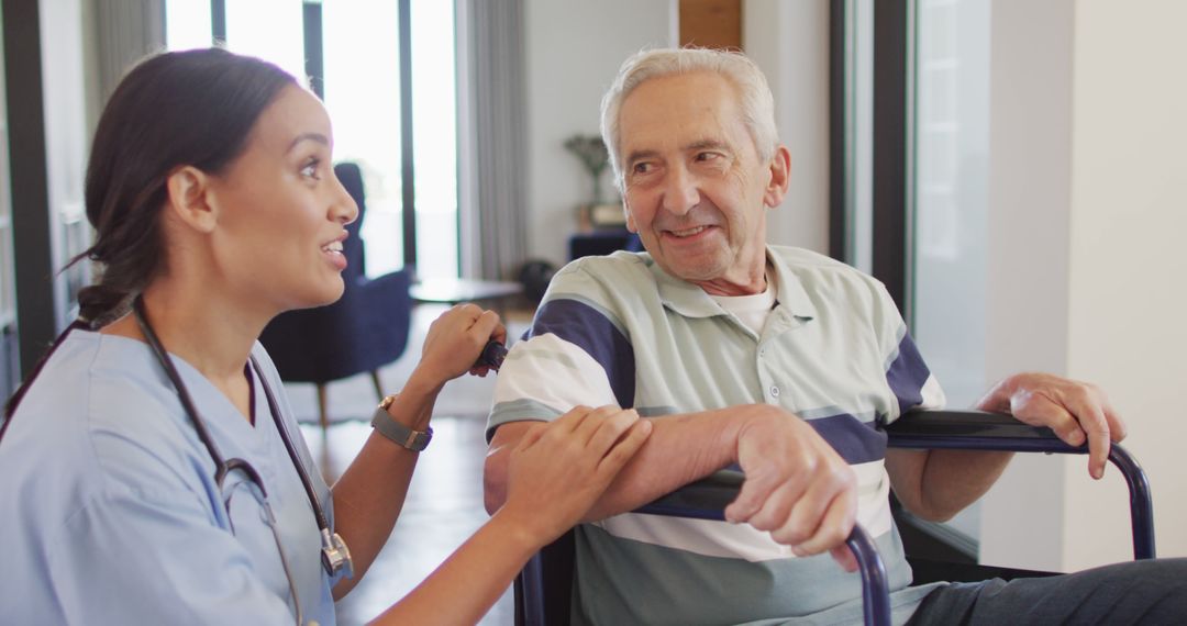 Image of happy biracial female doctor taking care of caucasian senior man - Free Images, Stock Photos and Pictures on Pikwizard.com