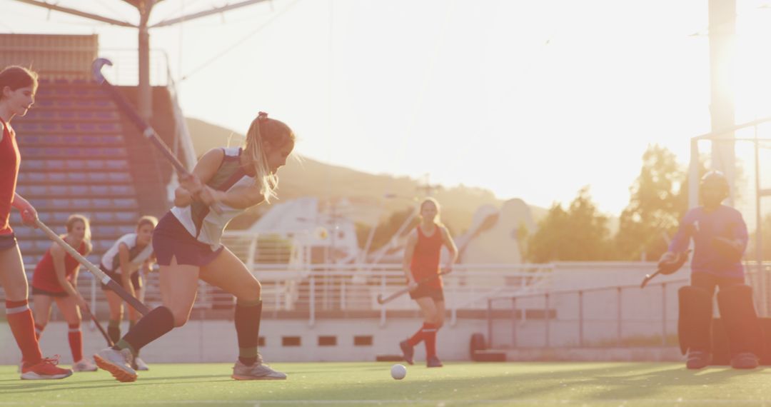 Women Field Hockey Players Competing in Sunset Light - Free Images, Stock Photos and Pictures on Pikwizard.com