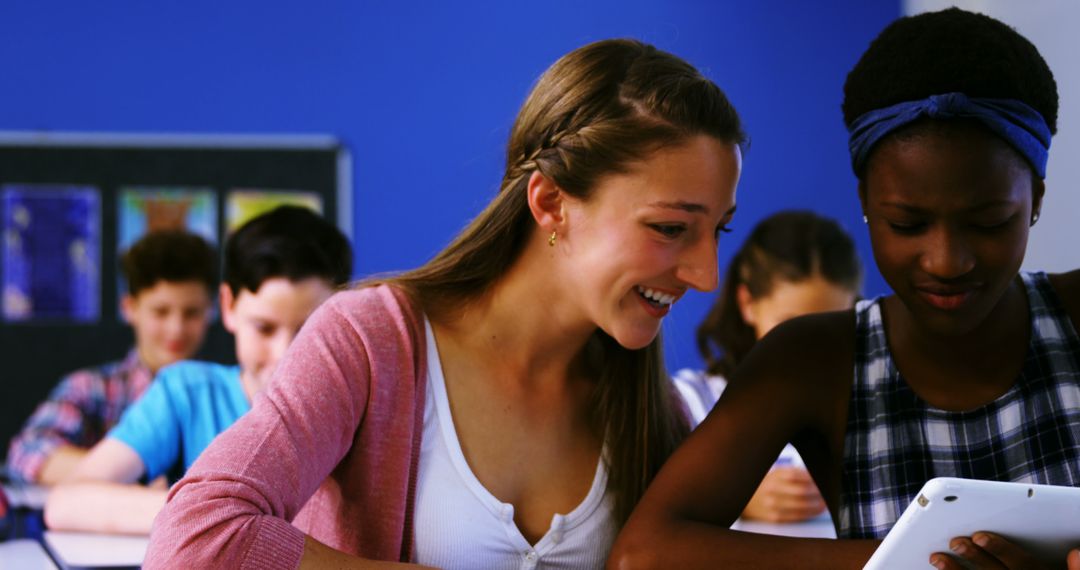 Teenagers Using Tablet Together in Class - Free Images, Stock Photos and Pictures on Pikwizard.com