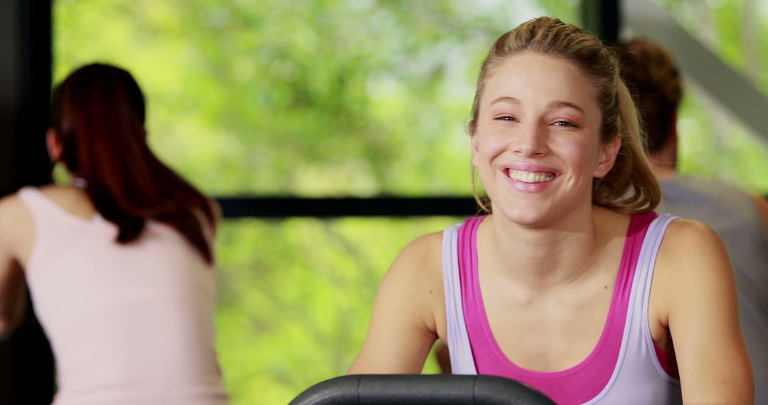 Happy Woman Smiling during Gym Workout - Free Images, Stock Photos and Pictures on Pikwizard.com