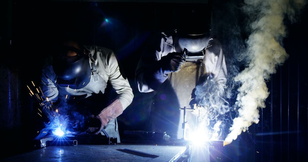 Skilled Welders Welding Metal in Industrial Workshop - Free Images, Stock Photos and Pictures on Pikwizard.com