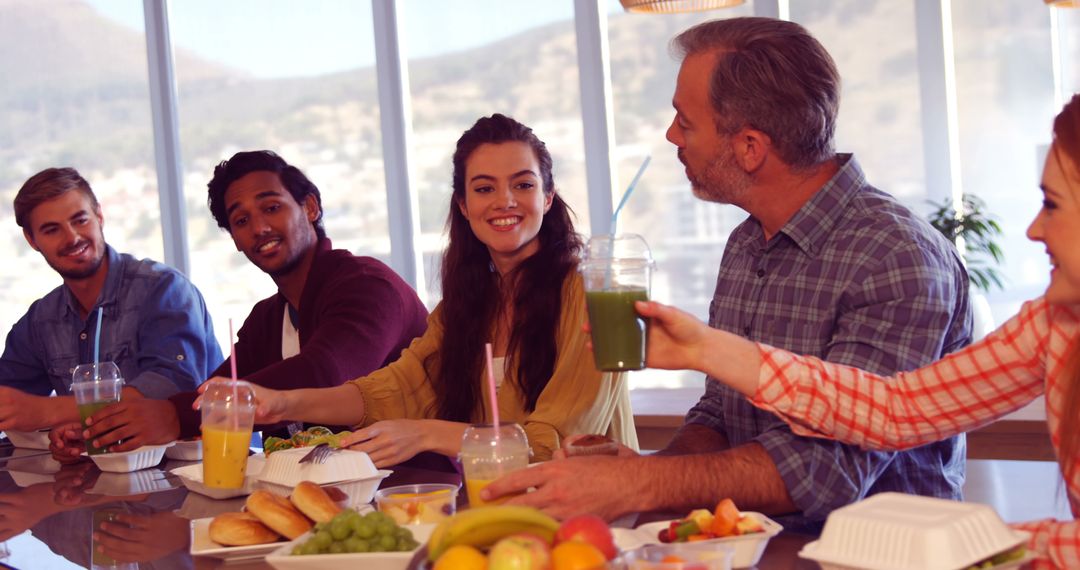 Diverse Group Enjoying a Meal in Friendly Gathering