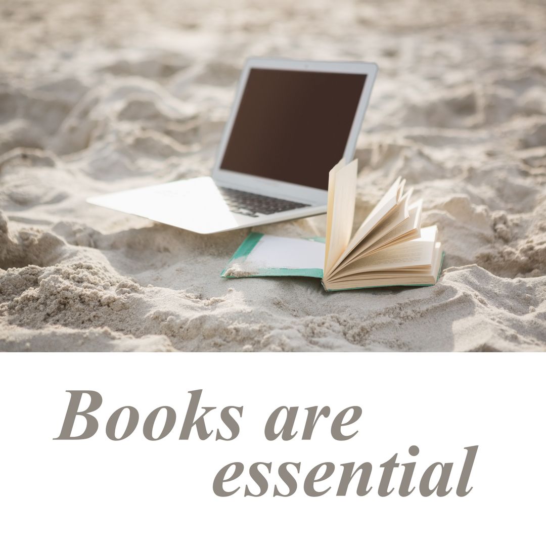 Open Book and Laptop on Beach for Morning Reading
