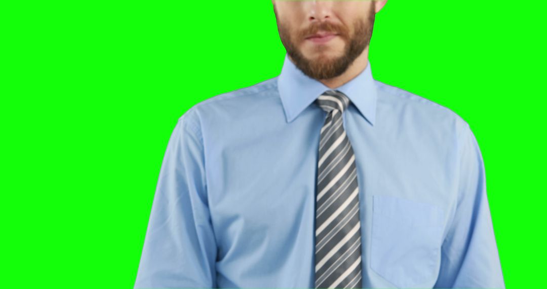 Businessman in Blue Shirt and Striped Tie Isolated on Green Background - Free Images, Stock Photos and Pictures on Pikwizard.com