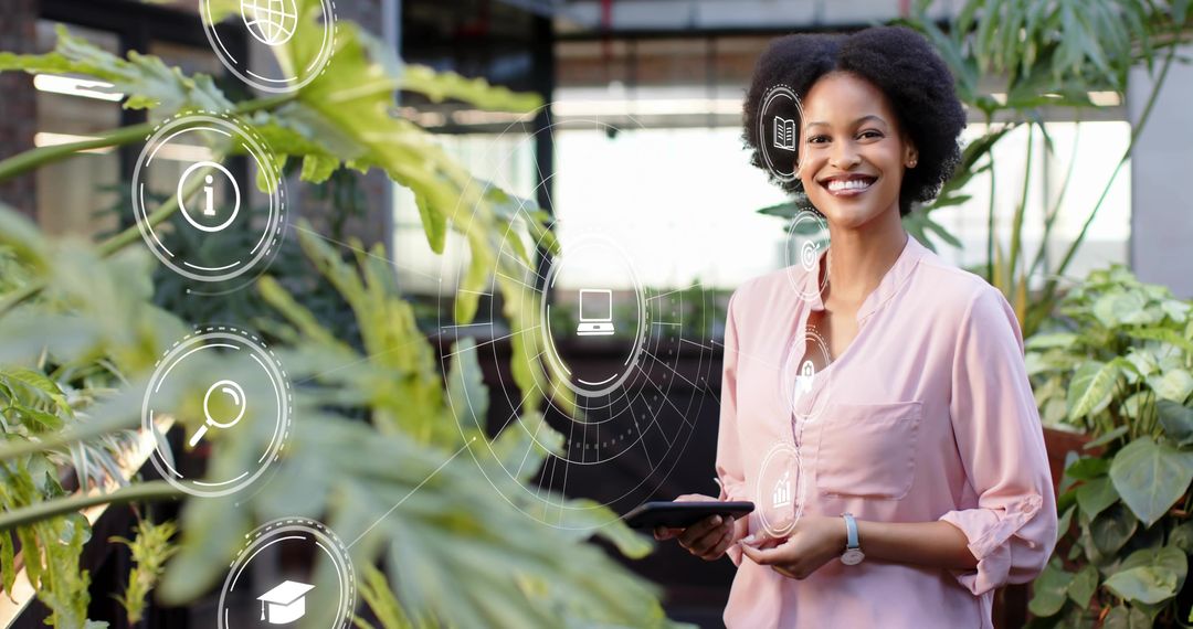 Smiling professional holding tablet in greenhouse surrounded by digital analytics overlay