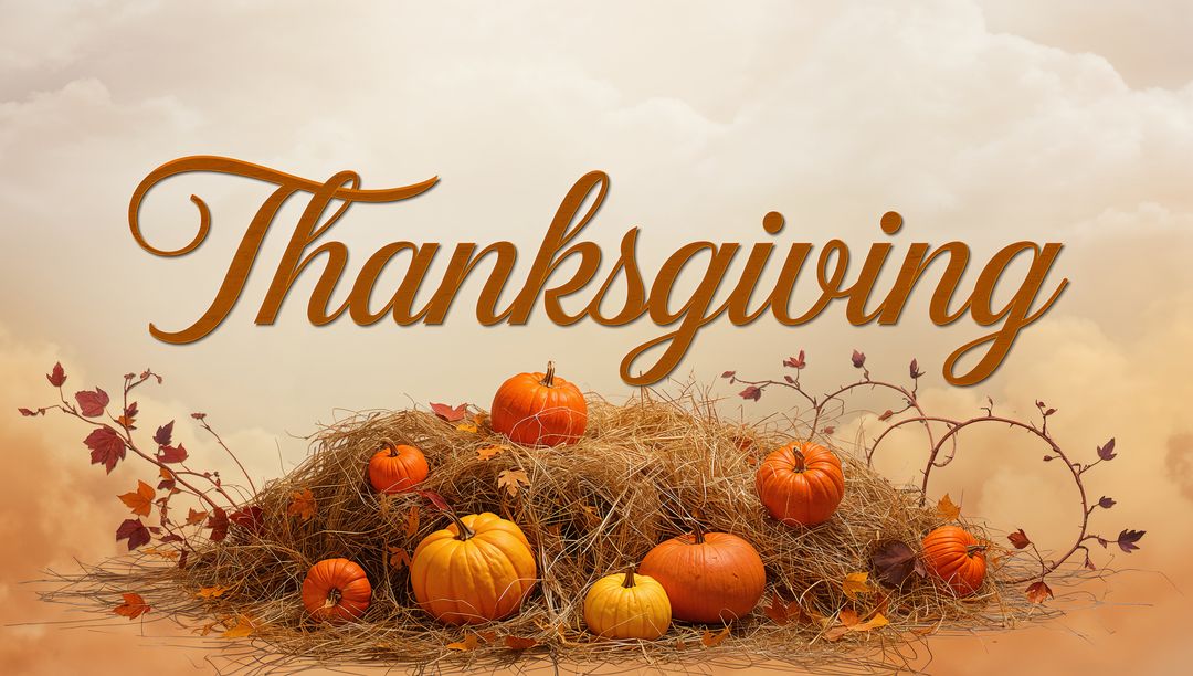 Thanksgiving Harvest Display with Pumpkins on Hay, Autumn Leaves and Handlettered Script