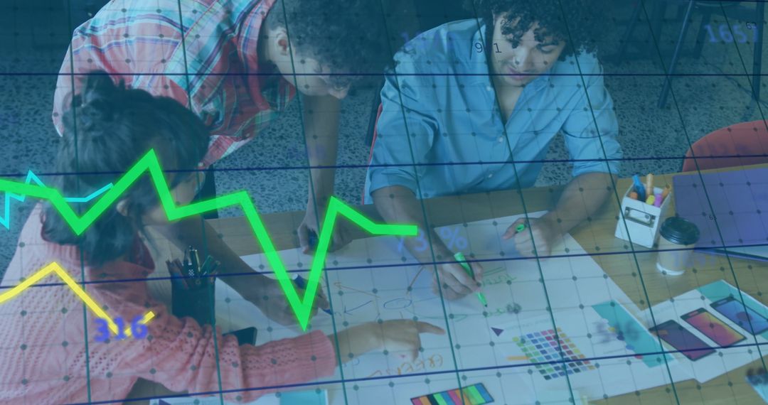 Design Team Collaborating with Creative Materials in Modern Office