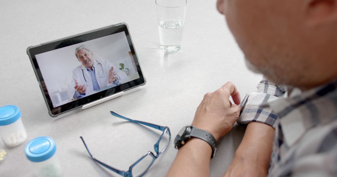 Senior Using Tablet for Telemedicine Consultation with Doctor - Free Images, Stock Photos and Pictures on Pikwizard.com