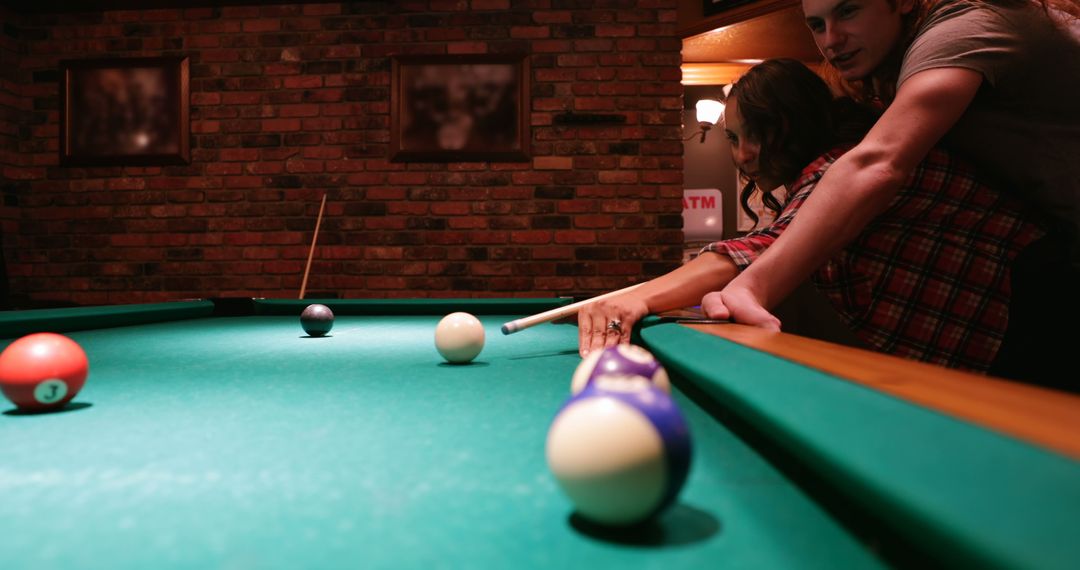 Couple Playing Pool Game in Cozy Billiard Room - Free Images, Stock Photos and Pictures on Pikwizard.com