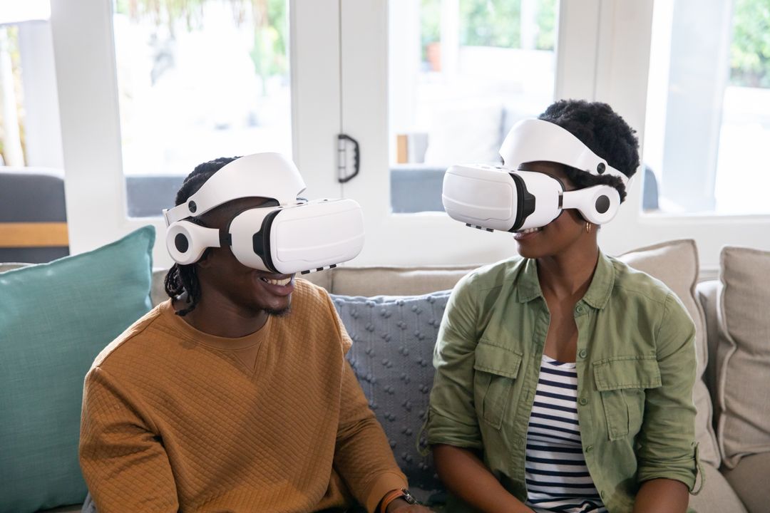 Couple Engaging in Virtual World with VR Headsets at Home